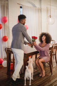 beautiful black women receiving flowers from her man
