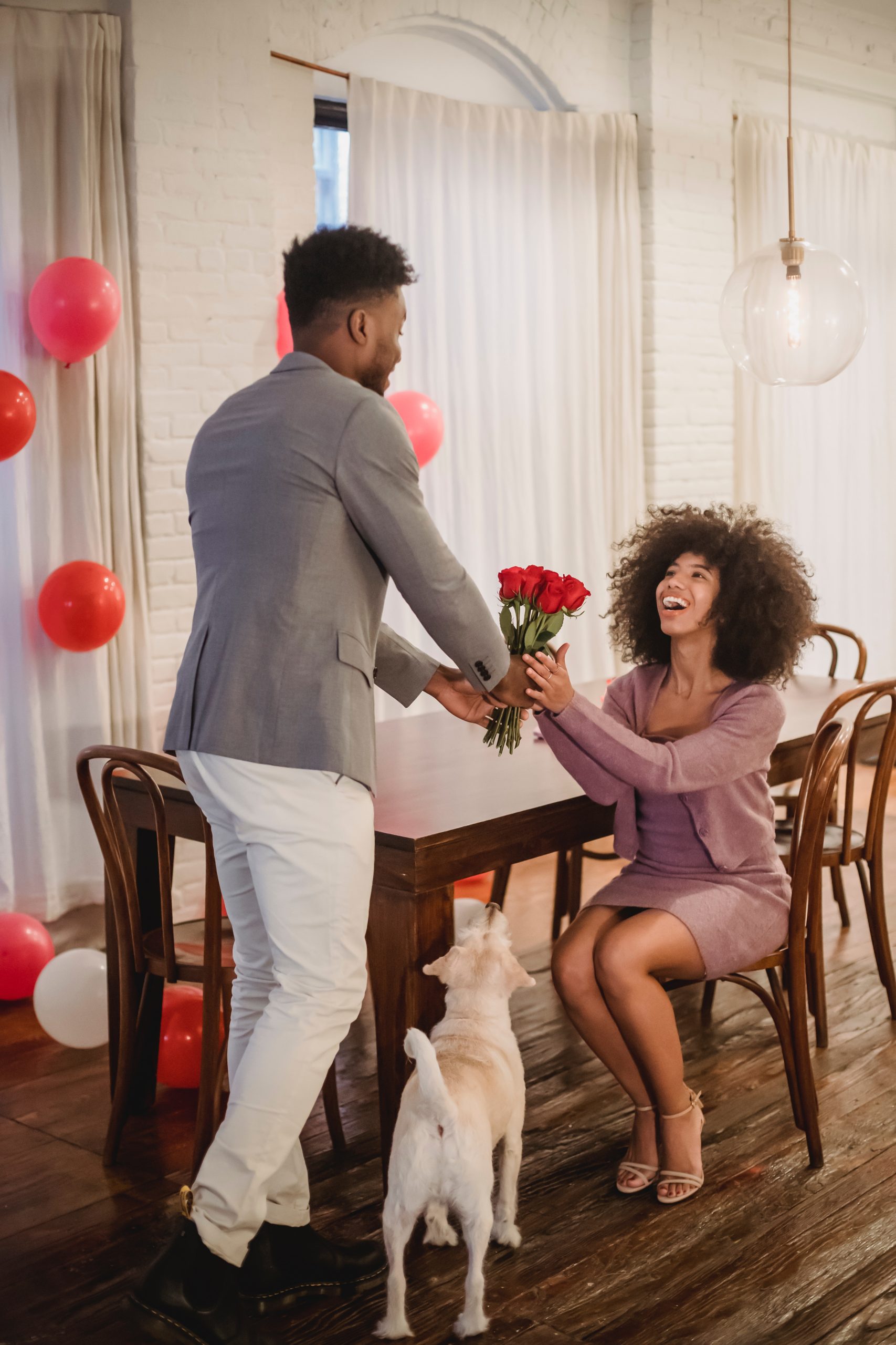 beautiful black women receiving flowers from her man