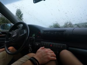 a man touching a women's knee while in the car